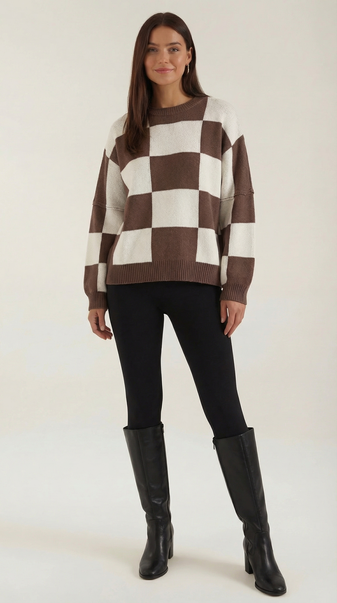 Knitted sweater with a check design