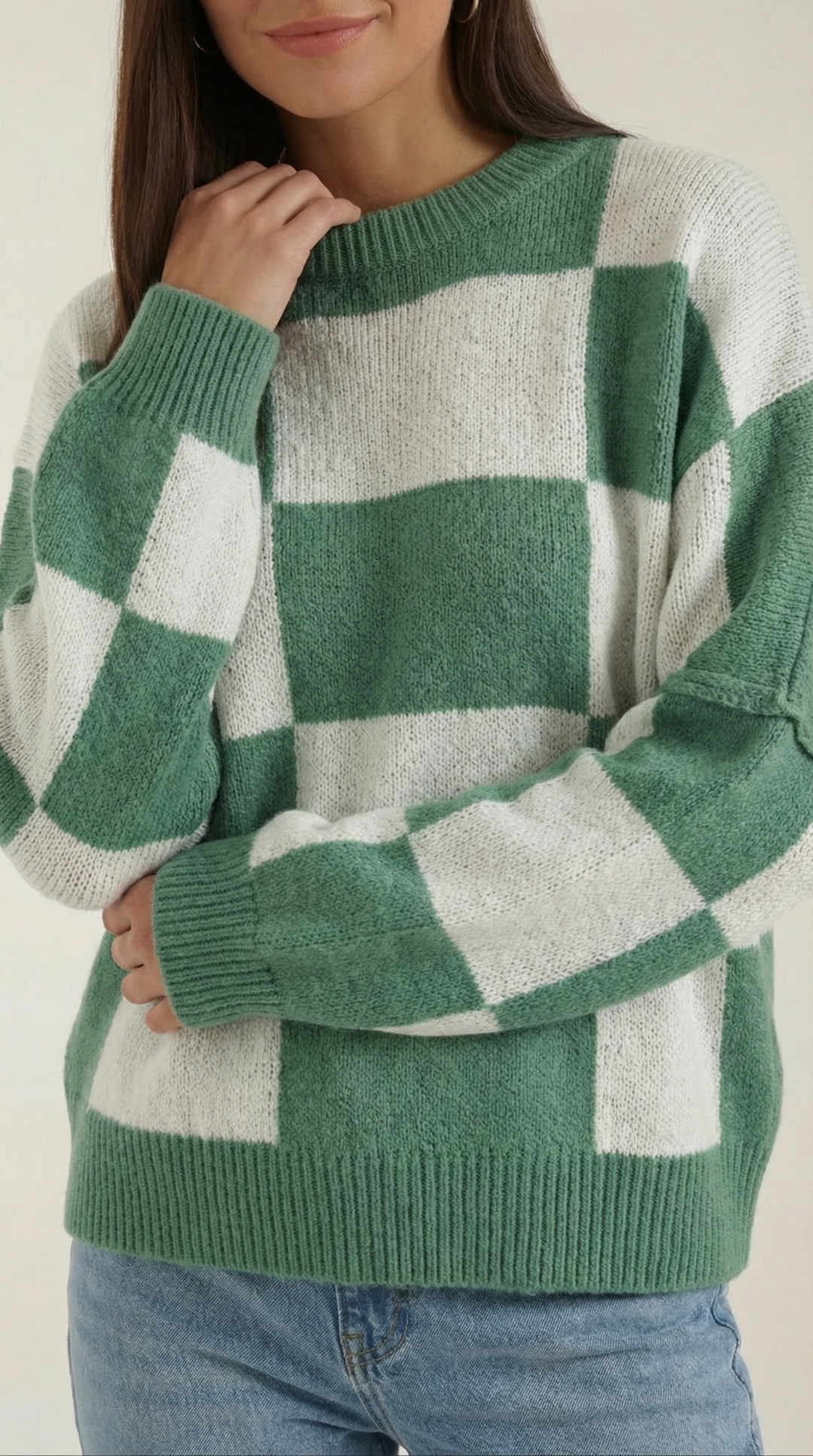 Knitted sweater with a check design