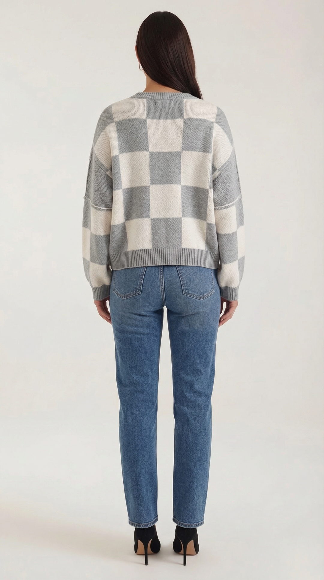 Knitted sweater with a check design