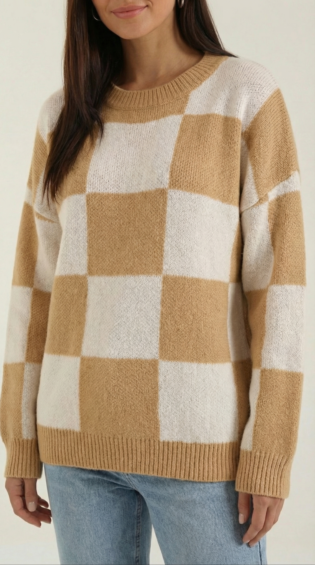 Knitted sweater with a check design