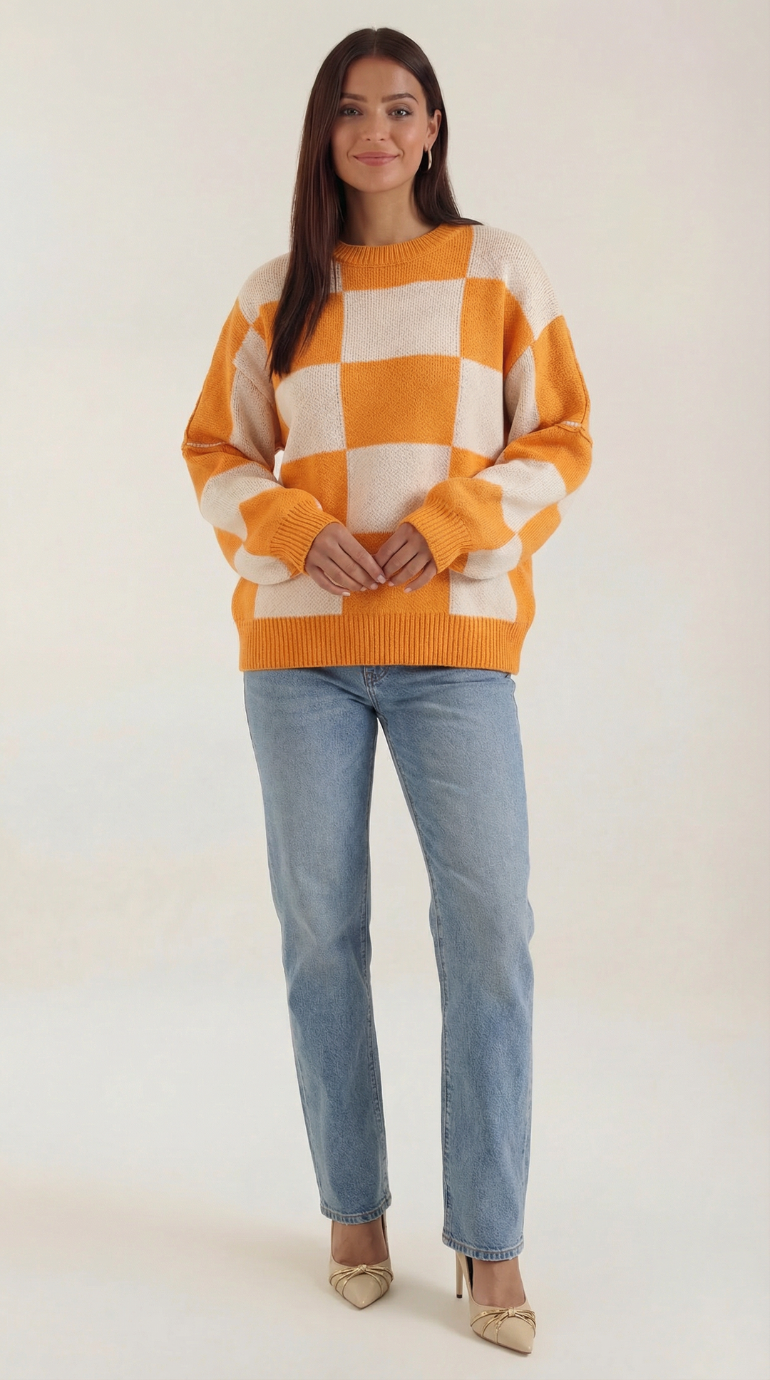 Knitted sweater with a check design