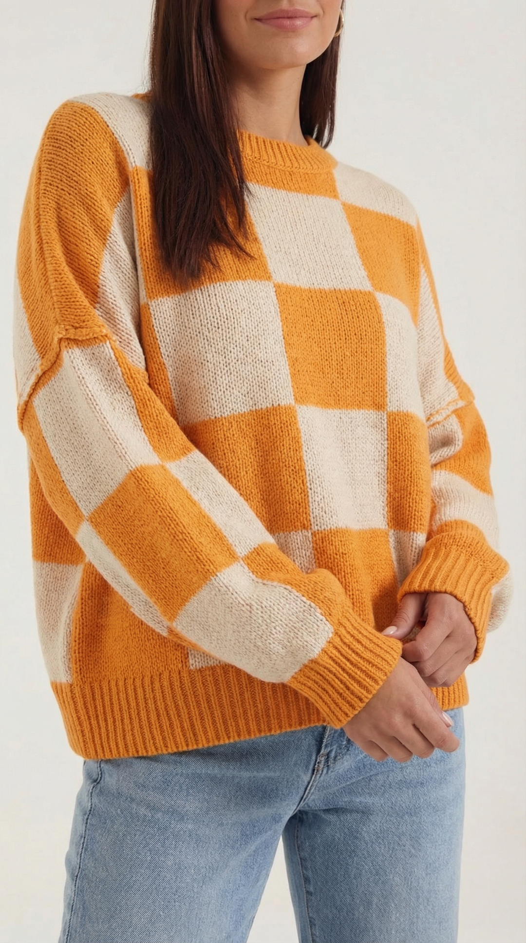 Knitted sweater with a check design