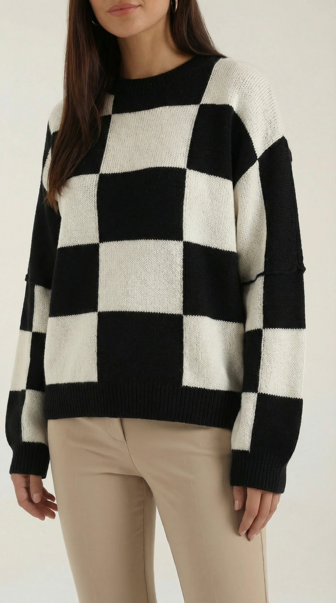Knitted sweater with a check design