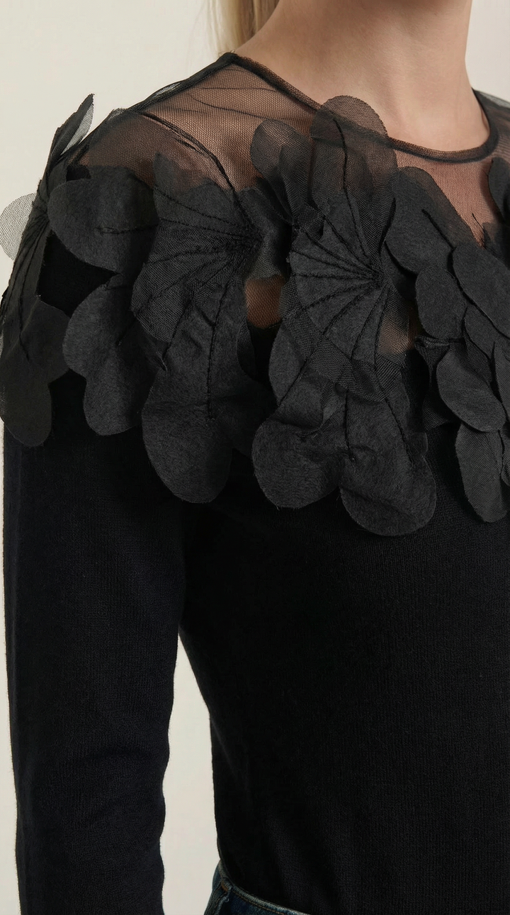 Knitted sweater with feather embellishments
